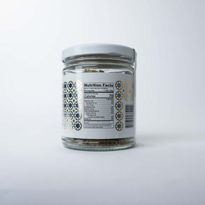 The back side of a za'atar package, displaying a white label with black text detailing the ingredients, nutritional information, and a barcode.