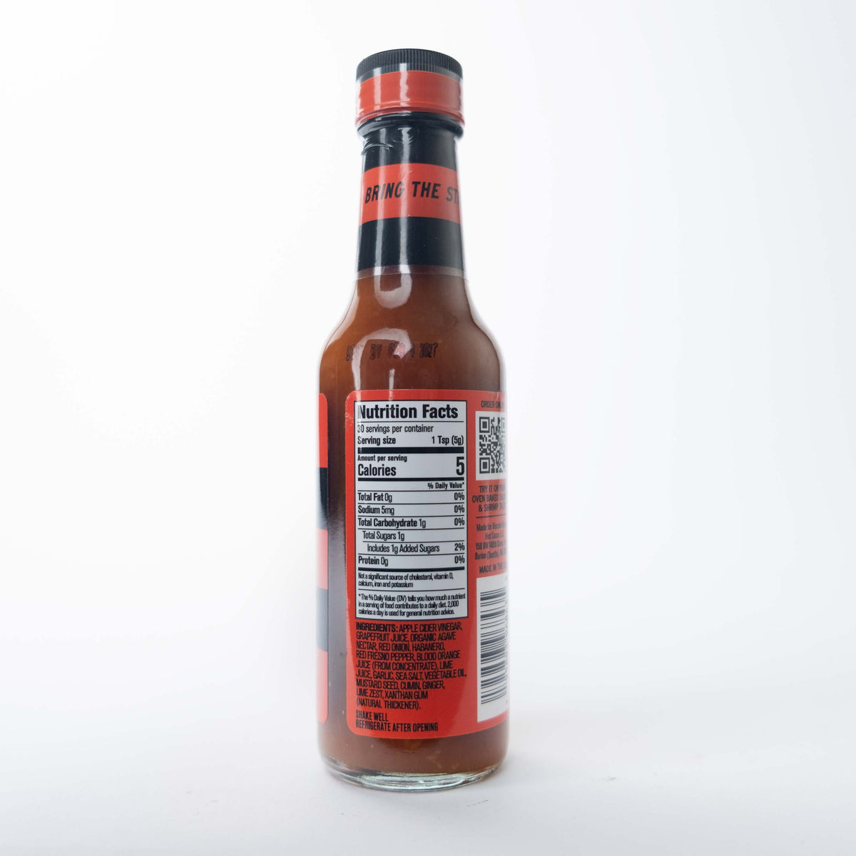 The back label of a Murder Hornet hot sauce bottle showing ingredients and a barcode on a red background.